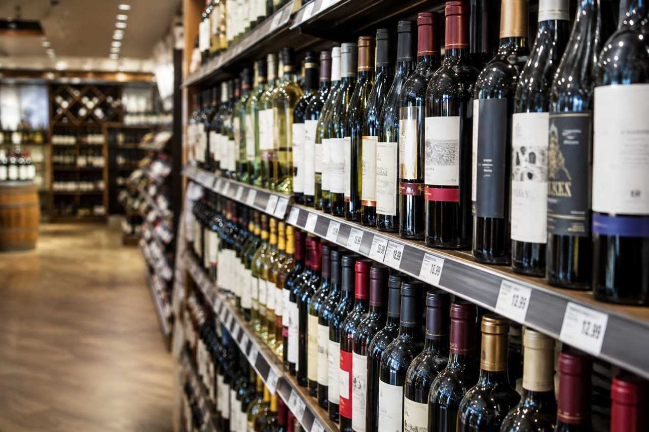 Wine bottles displayed with shelf price tags